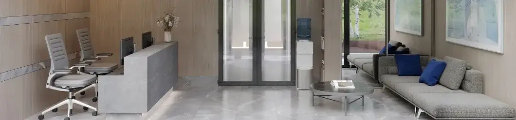 Modern office lounge with clean floors, minimalist furniture, and a fresh, inviting atmosphere.
